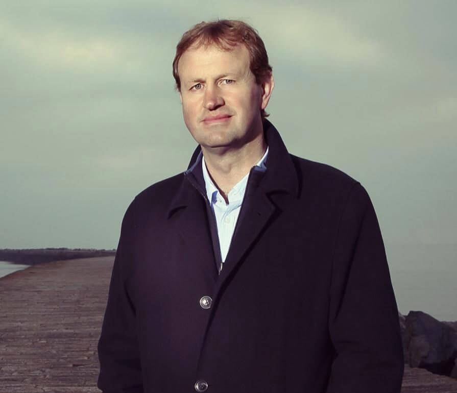 Jim O'Callaghan standing on Sandymount Strand